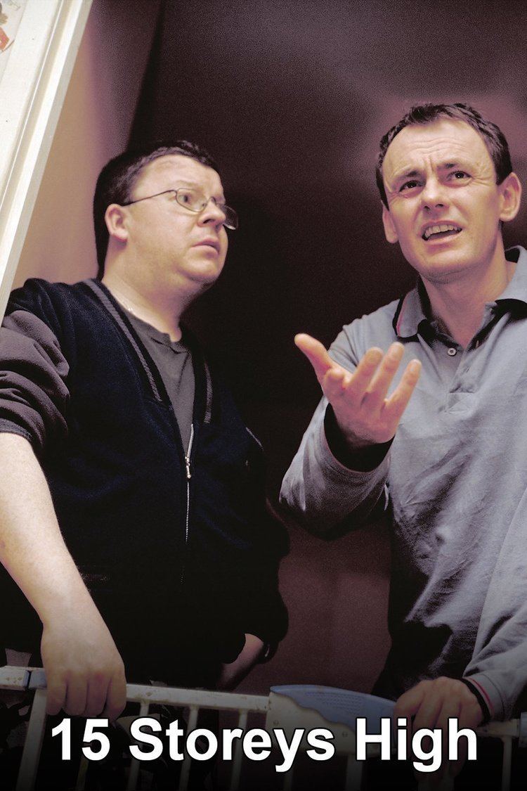 Perry Benson looking at Sean Lock in a scene from the 2002 sitcom 15 Storeys High