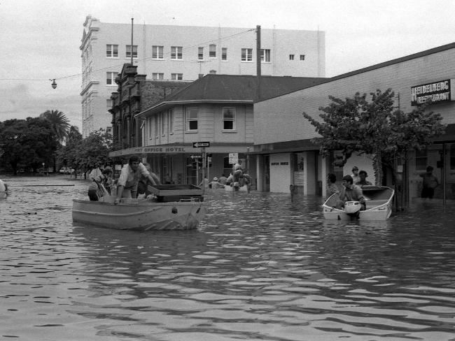 People riding on their boats near the Port Office Hotel during the devastating 1974 Brisbane floods.