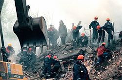Rescuers digging using excavators & looking for survivors after the Kashira road bombing.