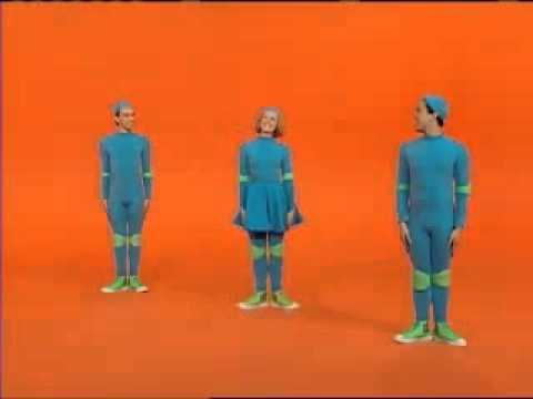 Casts of 4 Square, a Canadian television show for kids, wearing all blue outfits and green shoes with an orange background.