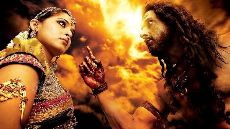 Anushka Shetty and Sonu Sood staring at each other in a scene from the 2009 Indian Telugu-language horror fantasy film, Arundhati