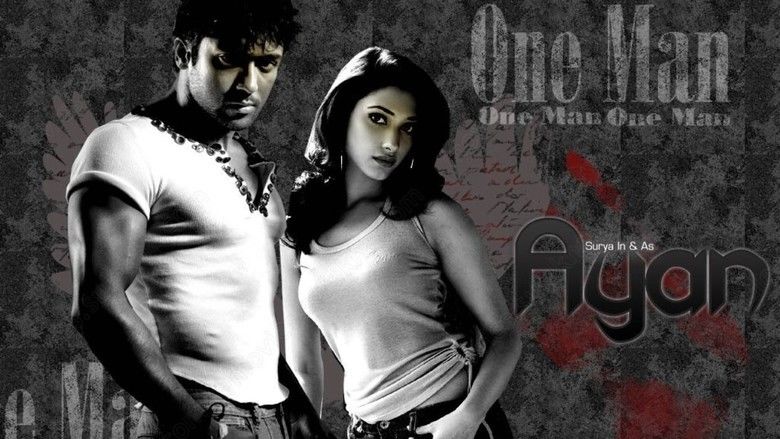 Poster of Ayan, a 2009 Tamil action film featuring Suriya as Devaraj Velusamy and Tamannaah as Yamuna.