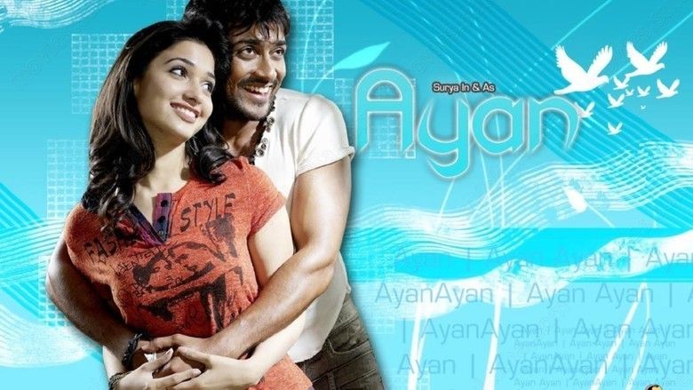 Poster of Ayan, a 2009 Tamil action film featuring Suriya as Devaraj Velusamy and Tamannaah as Yamuna hugging each other.