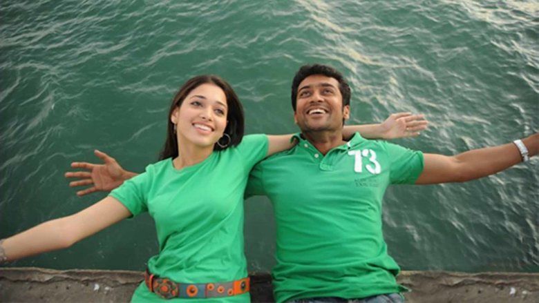 Scene from Ayan featuring Suriya and Tamannaah both wearing green shirts.