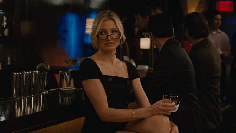 Cameron Diaz wearing a black dress and eyeglasses in a movie scene from Bad Teacher (2011 film)