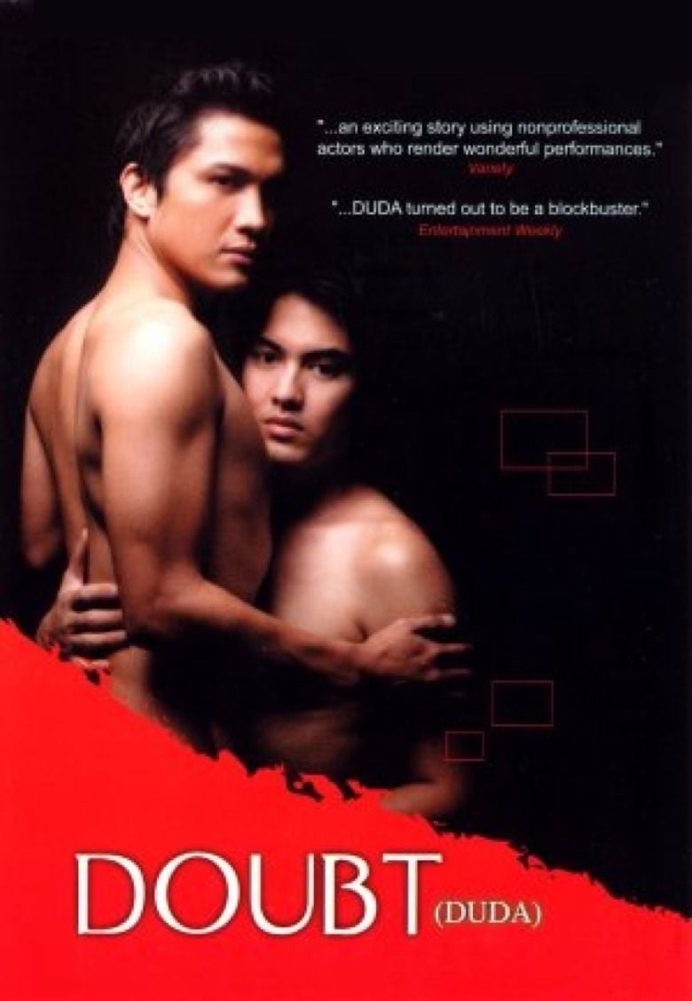 Movie poster of Doubt (Duda), a 2003 Filipino film about fidelity and deception in a gay relationship starring Andoy Ranay as Cris and Paulo Gabriel as Erick. Andoy and Paulo are topless while hugging each other.