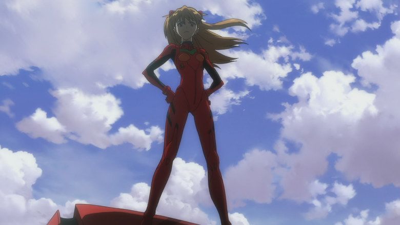A scene from the movie Evangelion: 30 You Can't (Redo) (2012). under a blue, cloudy sky, Asuka Langley Soryu is serious, looking down while standing on a red surface with both of her hands on her waist, she has long brown hair wearing a full red battlesuit and a red interface headset.