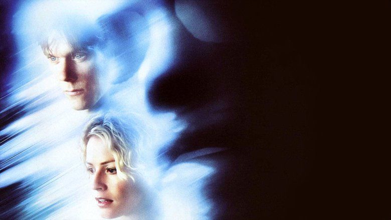 Movie poster of Hollow Man, a 2000 science fiction thriller film featuring Kevin Bacon and Elisabeth Shue with serious faces besides the character of Hollow Man.