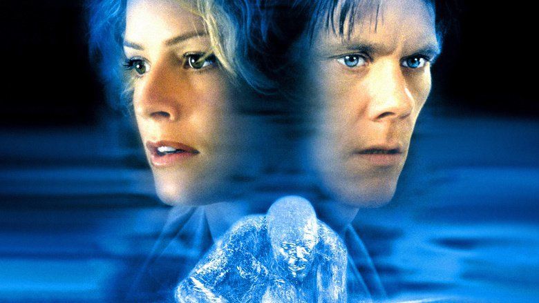 Movie poster of Hollow Man, a 2000 science fiction thriller film featuring Elisabeth Shue and Kevin Bacon with serious faces, and Hollow Man is kneeling down.
