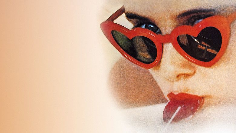 Sue Lyon as Lolita licking a lollipop and wearing heart-shaped sunglasses.