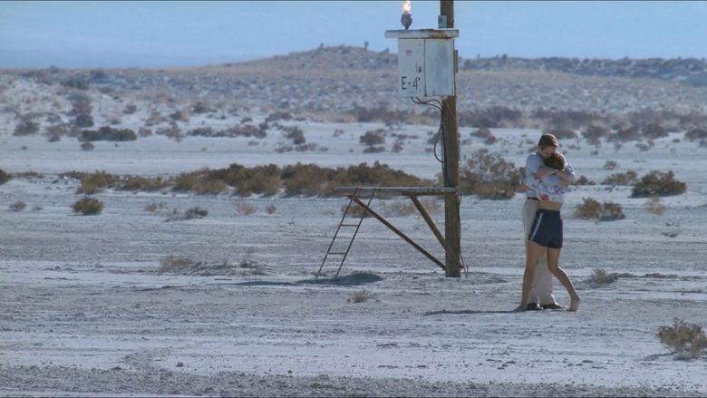 Jeremy Irons as Humbert embracing Dominique Swain as Lolita in the middle of the desert in a scene from Lolita, 1997.