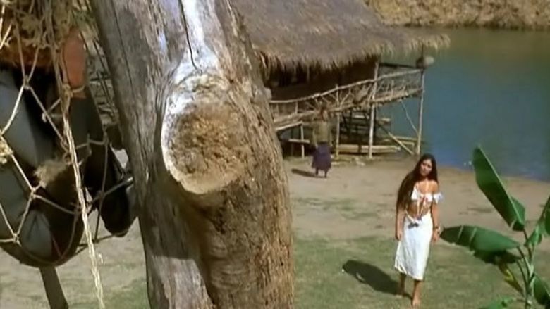Me Me Lai looking at the man hanging on a tree in a movie scene from the 1972 film Man from the Deep River