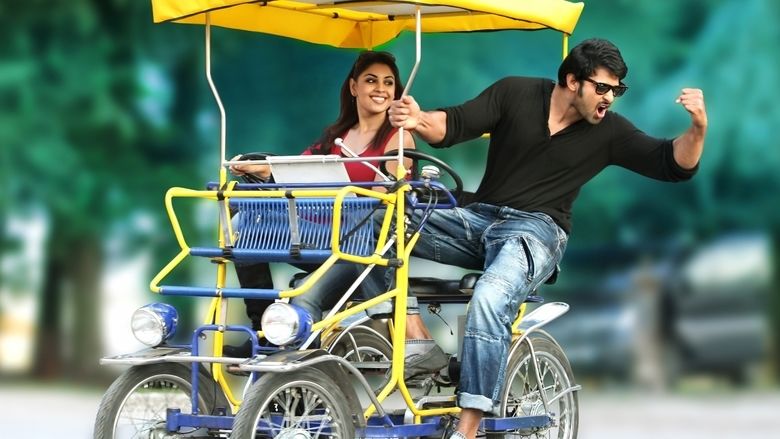 Prabhas riding on the rickshaw bike with Richa Langella while he is wearing a black long sleeve and sunglasses in a scene from the 2013 film, Mirchi