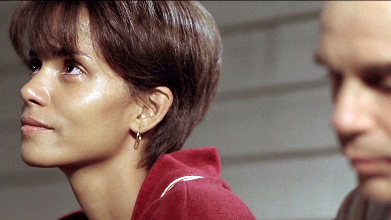 Halle Berry wearing a red robe in a movie scene from the 2001 American drama film Monster's Ball