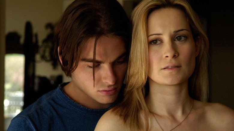 Kevin Zegers hugging Camille Sullivan while wearing a blue t-shirt in a mov...