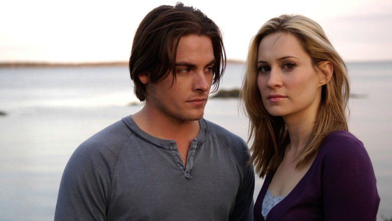Kevin Zegers looking at Camille Sullivan while he is wearing a gray t-shirt in a movie scene from the 2007 film, Normal
