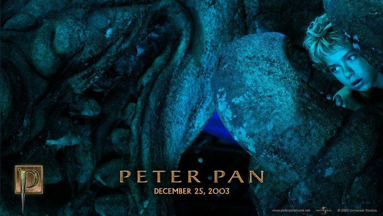 Peter Pan looking at Captain Hook and his crew from a cave in a scene from Peter Pan, 2003.