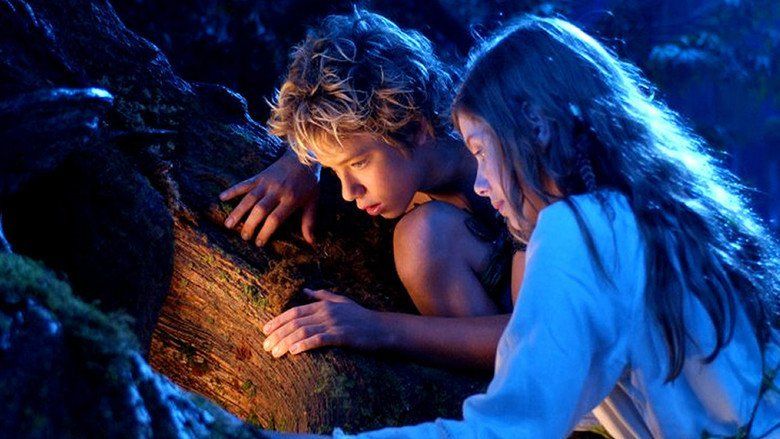 Peter Pan and Wendy looking at Captain Hook and his crew from a cave in a scene from Peter Pan, 2003.