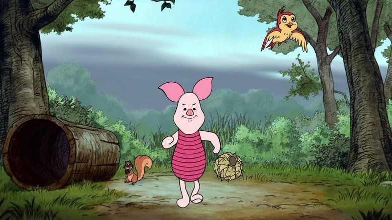 The movie scene of Piglet's Big Movie 2003 In a forest with grass land, trees, bushes and a trunk at the left, from left Squirrel is standing holding a acorn nut, has brown skin wearing a brown hat, 2nd from left, Piglet is smiling, walking, has round pointy pink ears, and pink body, 3rd from left is a Bird Flying has brown and yellow body.