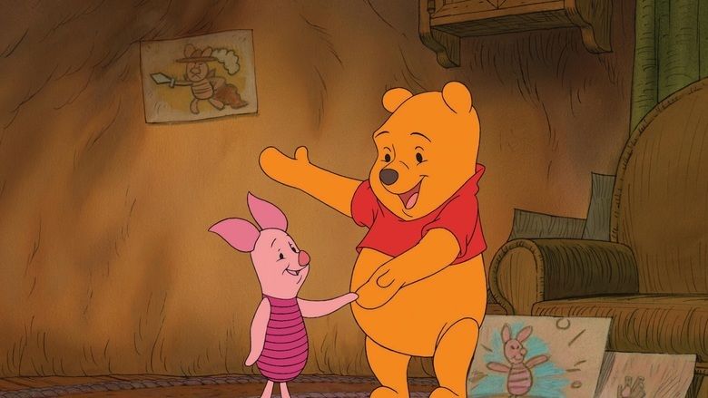 The movie scene of Piglet's Big Movie 2003, In a wooden room with a drawing on the wall and a couch at the right and a drawing of Piglets at the ground, from left, Piglet is smiling, standing, holding the hands of Winnie the pooh, has round pointy ear and pink skin, at the right, Winnie The Pooh is smiling, standing holding with his left hand with Piglet, right hand up open, has round ears and yellow skin, wearing a red shirt.