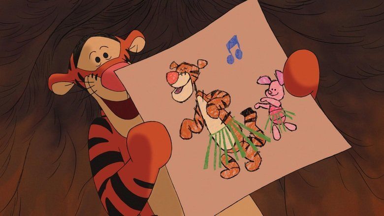 The movie scene of Piglet's Big Movie 2003, In a wooden room, Tigen is happy,  standing showing a drawing of him where he and piglet are dancing with a blue note at the top, with his both hands, has round ears, orange skin with black pattern.
