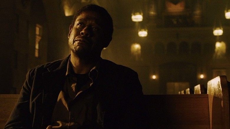 Forest Whitaker crying while looking afar inside the church and wearing a black t-shirt under a brown long sleeve and black coat in a scene from the 2008 drama film, Powder Blue