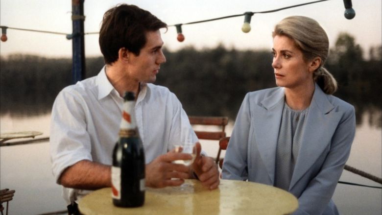 Wadeck Stanczak as Martin and Catherine Deneuve as Lili talking to each other in a movie scene from Scene of the Crime (1986 film).