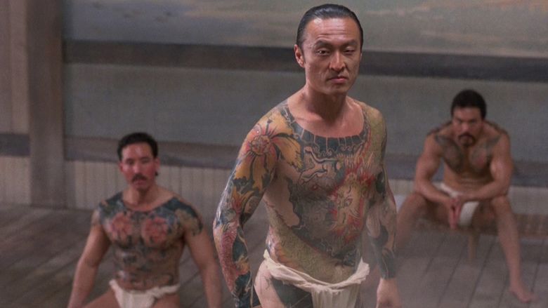 Cary-Hiroyuki Tagawa and the two men at his back wearing white underwear in a movie scene from the 1991 film Showdown in Little Tokyo
