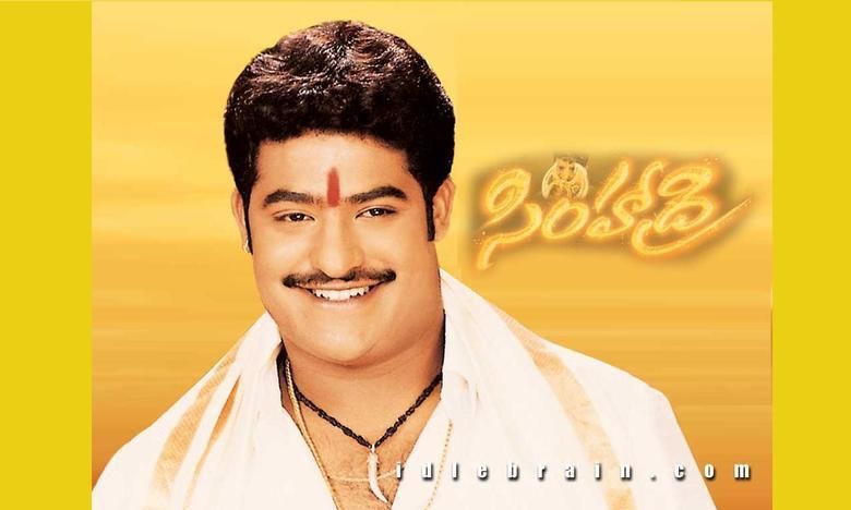 Jr. NTR smiling while wearing off-white long sleeves and necklace