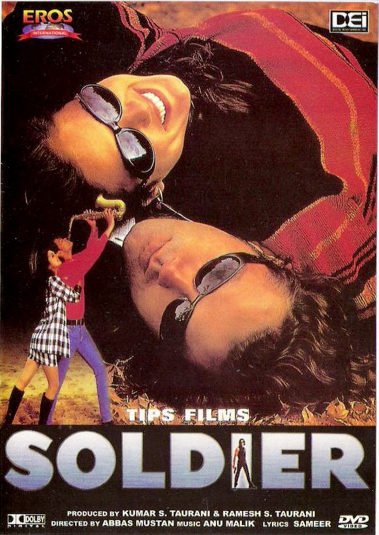 Bobby Deol and Preity Zinta smiling while lying on the ground in the movie poster of the 1998 film "Soldier"