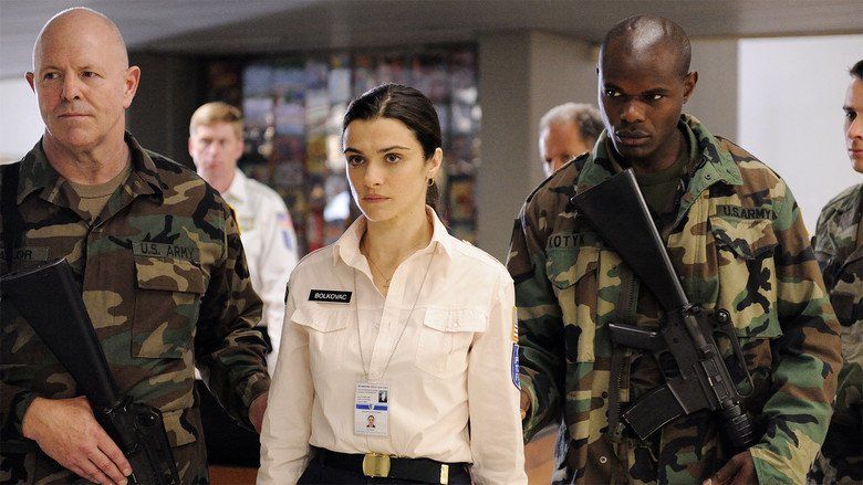 The movie scene of "The Whistleblower" featuring Rachel Weiszas Kathryn Bolkovac with the U.S armies beside her