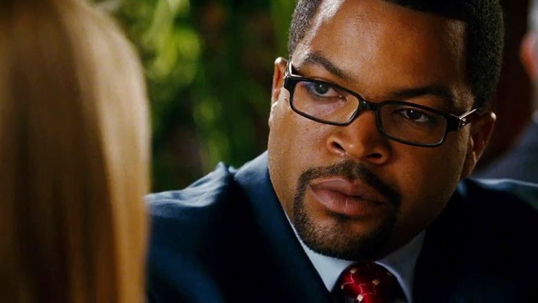 XXX: State of the Union movie scene featuring Ice Cube as Lieutenant Darius Stone wearing eyeglasses and a blue suit.