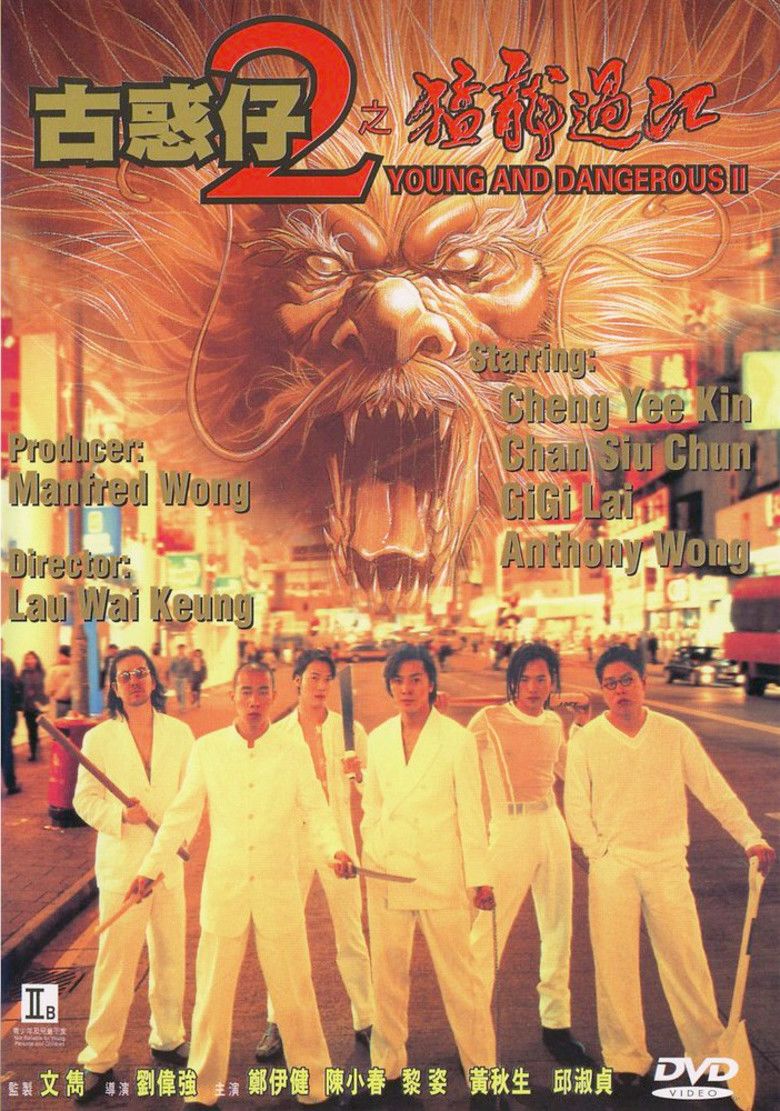 A movie poster of the 1996 film Young and Dangerous 2 starring- Ekin Cheng, Jordan Chan, Gigi Lai, Anthony Wong Chau-sang, Chingmy Yau, and Jerry Lamb standing on the street with a dragon face in the background, while holding a stick and shovel, and all wearing white clothes.