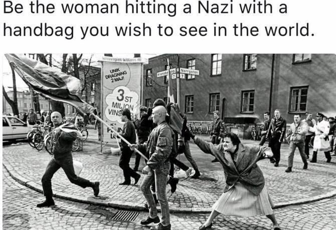 A Woman Hitting a Neo-Nazi With Her Handbag You need to see this picture of a woman hitting a neoNazi with her