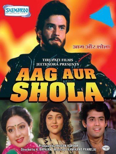 Poster of Aag Aur Shola, a 1988 Indian Bollywood film starring Jeetendra as Vishal, Sridevi as Aarti, Mandakini as Usha, Shakti Kapoor as Nagesh, and Kader Khan as College Lecturer.