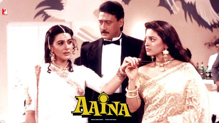 Juhi Chawla and Jackie Shroff looking at Amrita Singh in a movie scene from the 1993 romantic drama film, Aaina