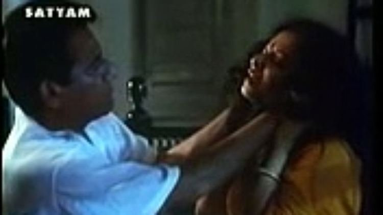 A movie scene of Rekha as Mansi with a man holding her neck in Aastha: In the Prison of Spring (1997)