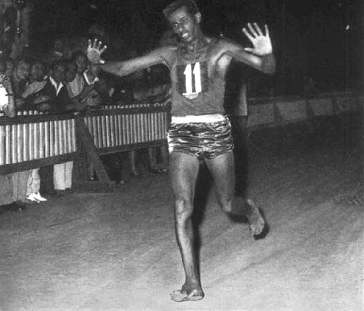 Abebe Bikila Abebe Bikila of Ethiopia running barefoot about to win