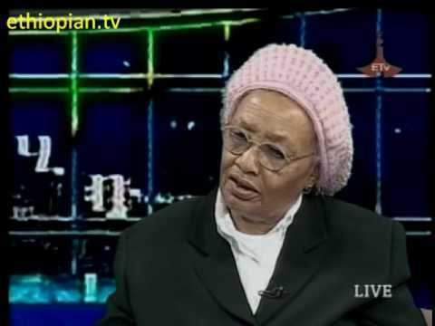 Abebech Gobena has been interviewed at "Ethiopian.tv" while wearing a hat and a coat