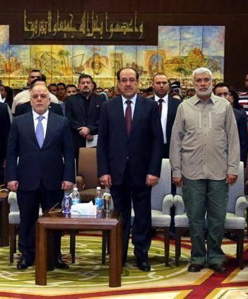Abu Mahdi al-Muhandis Iraqi Prime Minister photographed with SDGT Abu Mahdi al Muhandis