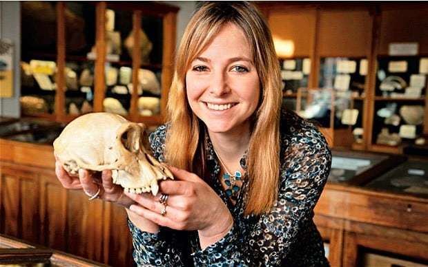 Alice Roberts holding an animal skull