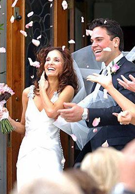 Alicia Rickter smiling with Mike Piazza after their wedding ceremony.