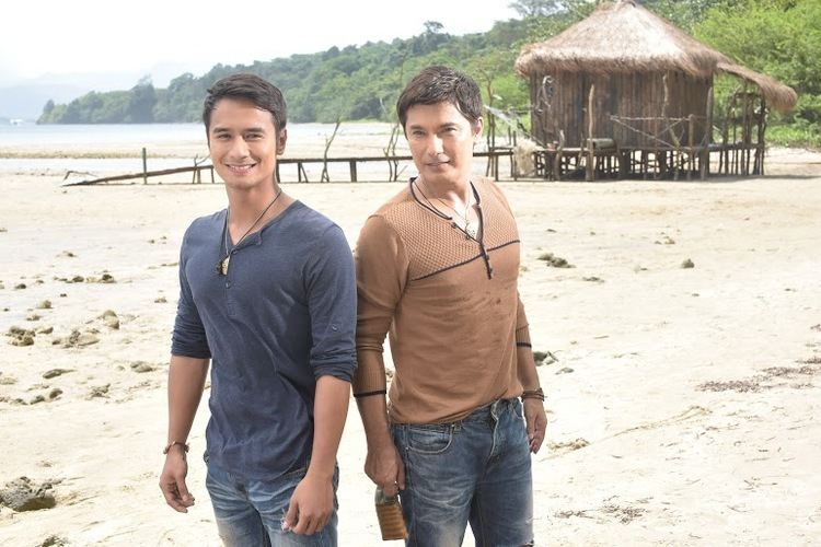 Albert Martinez and JM de Guzman posing together and smiling on a beach set of the TV series All of Me.