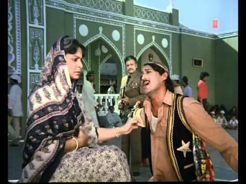 Waheeda Rehman talking to Jackie Shroff while Waheeda Rehman looking at them in a scene from the 1986 Bollywood Masala film, Allah Rakha