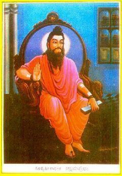 Allama Prabhu sitting on his throne while wearing a pink top and orange pants