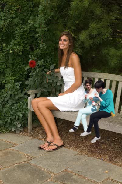A funny edited picture of Allyssa DeHaan smiling while sitting on a bench while wearing a white dress with two tiny people