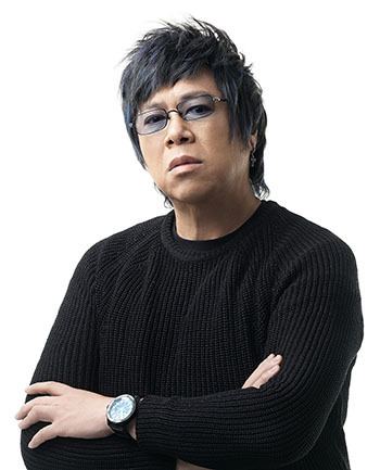 Alvin Leung wearing a black long-sleeved shirt, a watch, and a pair of eyeglasses