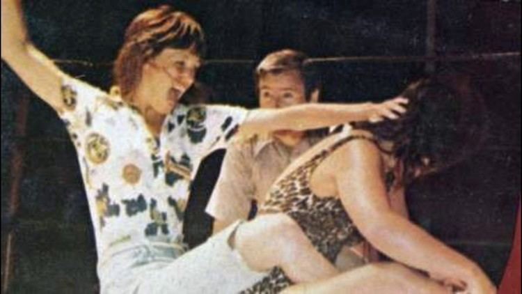 Ann Casey in a wrestling match against an opponent.