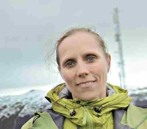 Anna Bågenholm smiles while wearing a yellow jacket