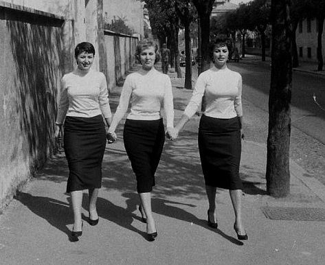 Anna Maria Villani Scicolone holding hands while walking with her mother Romilda, and her sister Sophia Loren